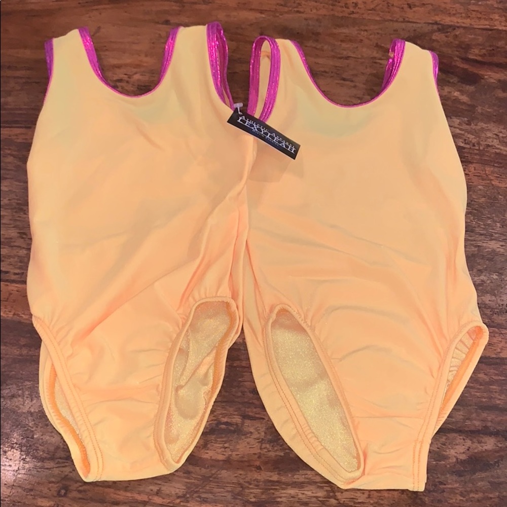 Two Bright Yellow Leotards with Electric Pink